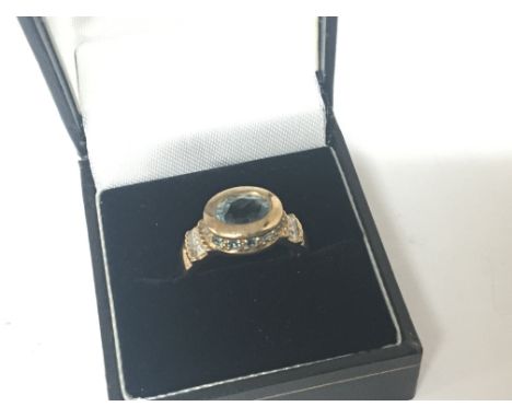 A 9carat gold ring set with aquamarine stone and small diamonds. ring size PWeight 5g