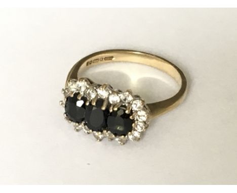 A 9ct gold 3 stone cluster ring