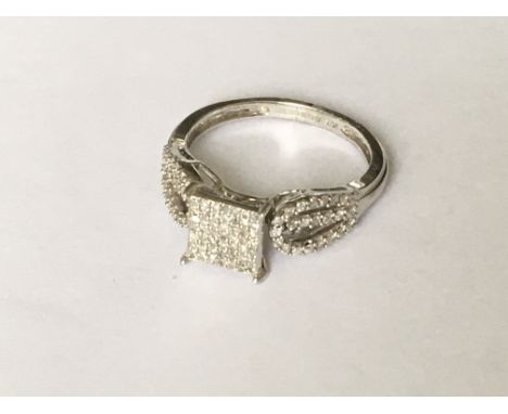 An unusual pave set diamond ring in white gold