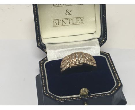 A 9carat gold ring set with a pattern of diamonds ring size U weight 7g