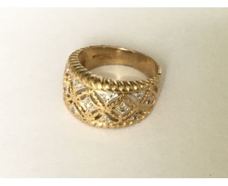 A filigree diamond set ring