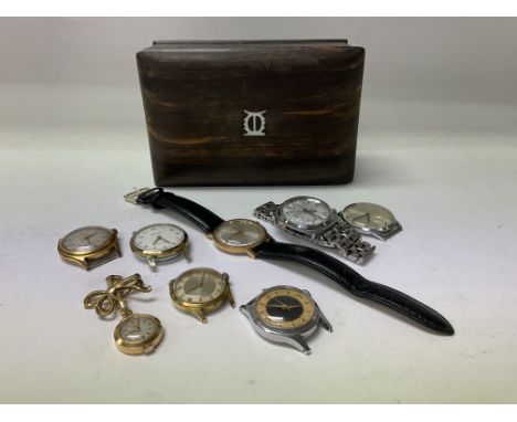 A small hardwood African box together with a collection of vintage watches.