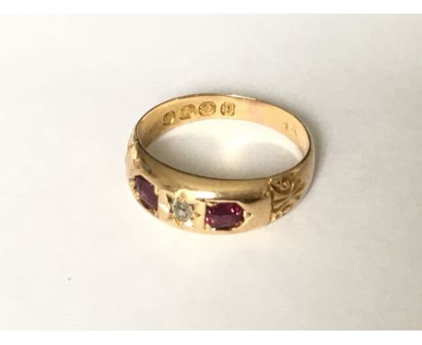 A Victorian ruby and diamond 3 stone ring in 18ct gold