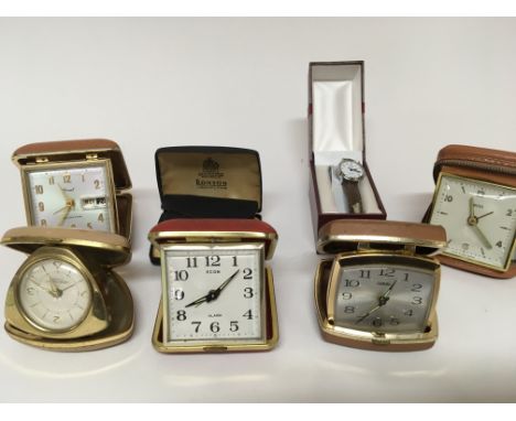 A collection of Vintage traveling alarm clocks and a Ronson lighter (a lot)