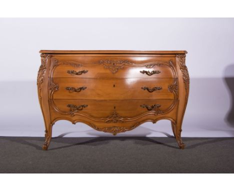 McLean of Brighton, hand made walnut commode, the top bomb shape, with three drawers, carved with shells and scrolls, shaped 