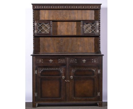 Reproduction dark oak finish dresser, two shelf delft rack incorporating two leaded glazed panelled doors, two drawers and tw