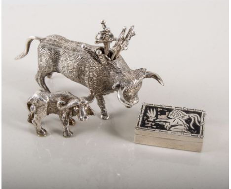 Mexican sterling silver bull containing cocktail sticks, a water buffalo mini model place setting and a Niello ware snuff box