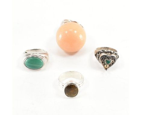 An assorted collection of silver &amp; stone set dress rings. The lot to include; a statement peachy coloured round stone rin