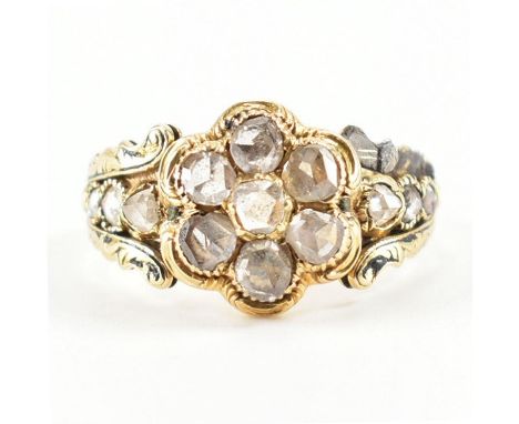 A William IV hallmarked 18ct gold and diamond ring. The ring set with a central rose cut diamond cluster&nbsp; flanked by scr