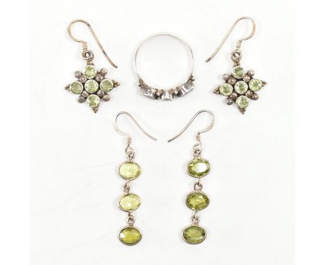 A collection of 925 silver &amp; peridot set jewellery. The lot to include a three stone ring set with navette &amp; round cu