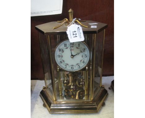 Brass 100 day perpetual motion mantel clock. (B.P. 21% + VAT) Make of movement is KUNDO condition is ok but not tested