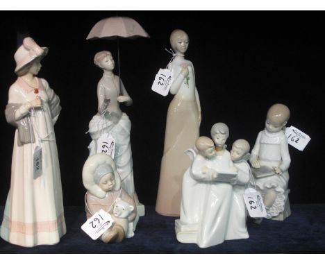 A group of six Spanish porcelain figurines and figure groups to include; Nao, Lladro and others. (6) (B.P. 21% + VAT) No dama