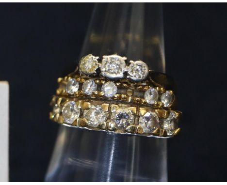 18ct gold three stone diamond ring, yellow metal and diamond 6 stone diamond ring and an 18ct gold ring set with white stones