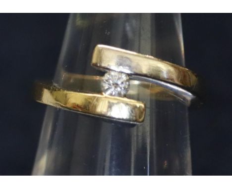 14ct two colour gold and diamond crossover style ring.  Ring size K.  Weight 3.9 grams approx.(B.P. 21% + VAT) 