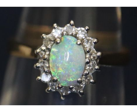 9ct gold oval opal and diamond ring.  Ring size L & 1/2.  Weight 2.5 grams approx.(B.P. 21% + VAT) 