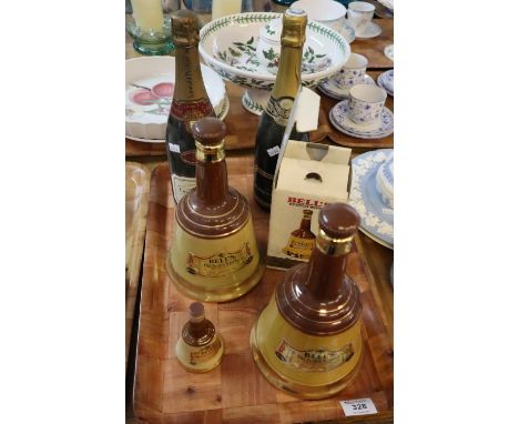 Tray of Wade Bell's Scotch whisky decanters, some sealed, together with two bottles of champagne, one Laurent-Perrier. (6)(B.