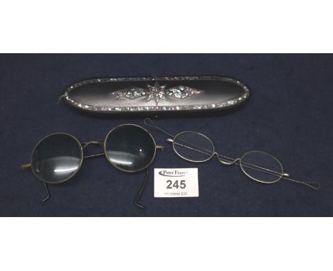 Victorian papier mache mother of pearl inlaid spectacle case with a pair of steel spectacles therein, together with a pair of