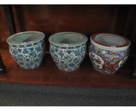 Chinese design ceramic jardiniere or fish tank with reserved foliate panels, together with a pair of Chinese design ceramic f