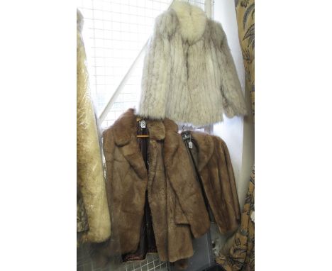Four vintage fur jackets to include; a blue fox fur jacket by 'Saga Fox', a light brown Mink fur jacket and two other light b