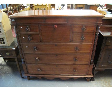 Victorian mahogany Scotch chest of drawers having shaped front and standing on baluster turned supports. 134 x 55 x 132cm app