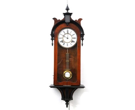 An attractive Victorian walnut veneered and ebony Vienna style wall clock
With a 16cm white enamelled dial with blued hands, 