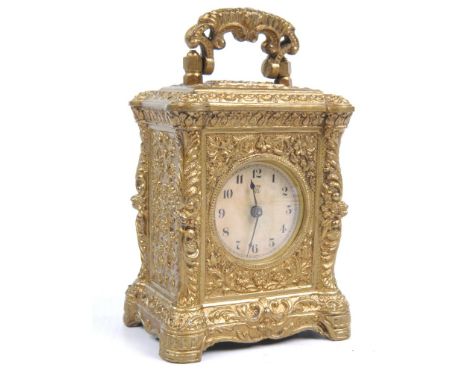 An American Waterbury Clock Company wind up carriage clock, Circa 1880 - 1900
The brass case with scrolling foliate tendril d