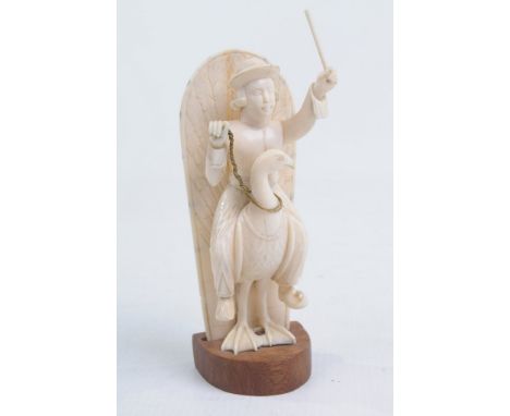 An early 20th Century Continental ivory carving of a Dutch man
The figure wearing traditional dress and holding a stick aloft