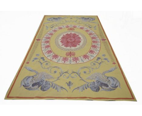 A 20th Century tapestry wall hanging
Of rectangular form the lemon yellow ground detailed with cartouche with pink fern borde