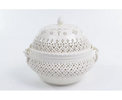 A Leeds Pottery Creamware chestnut basket and cover, 20th Century Rising from a low circular foot rim the compressed globular