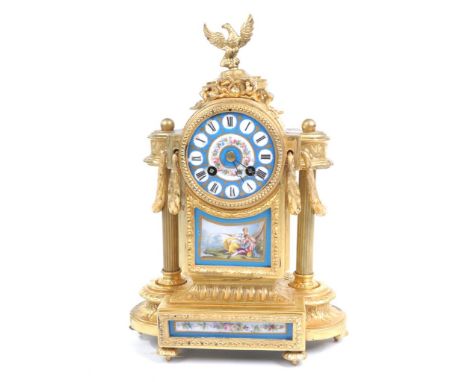 A 19th Century French Pinchon Fils Aine' and Boudoir Clock
The gilt ormolu case rising on six flower head pad supports extend