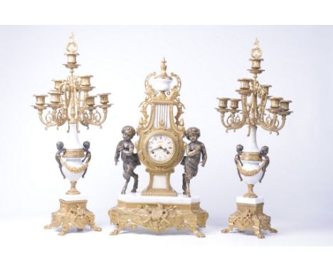 A Louis XV style clock garniture, 20th Century
The clock with a 9cm white dial, printed made in Italy with Roman and Arabic n