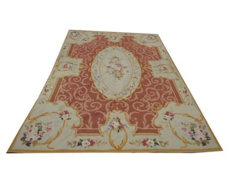 A 20th Century tapestry wall hanging
The central vignette embroidered with sprays of flowers reserved against a dark umber gr
