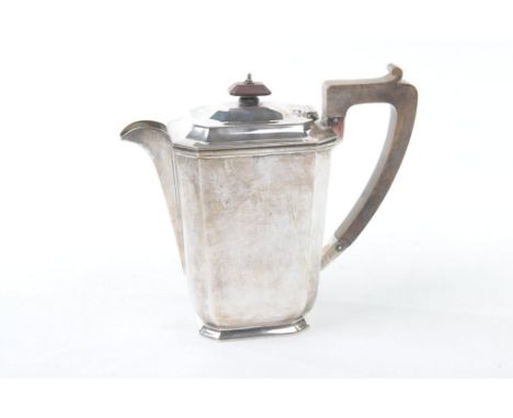 A silver hot water pot, by Harrison Brothers &amp; Howson, Sheffield 1935
Of plain panelled form with canted corners, to a wo