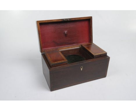 A 19th Century mahogany tea caddy
The box of a rectangular form, inlaid with key fret borders and ivory escutcheon, the hinge