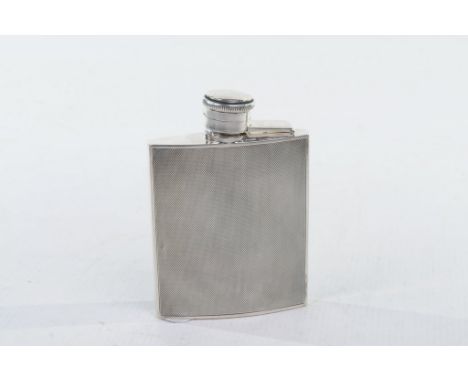 A silver hipflask, by Goldsmiths &amp; Silversmiths Co. Ltd., London 1930
Of rectangular form, with engine turned decoration 