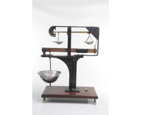 A set of early W.T. Avery Ltd shop balance scales
The wooden plinth base resting on an adjustable silvered supports extending