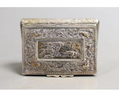 A 19th century continental gilt white metal rectangular bombe shaped snuff box, embossed with foliate scrolls and central sta