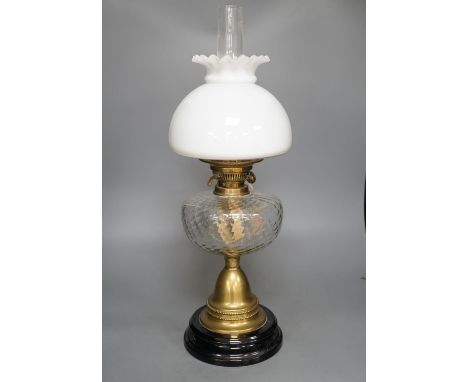 A brass oil lamp with opaque shade 60cm total height