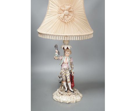 A German porcelain 'matador' lamp and shade 57cm total
