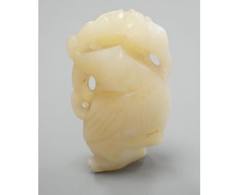 A Chinese bowenite jade carving of a boy with a branch,5.5 cms high.