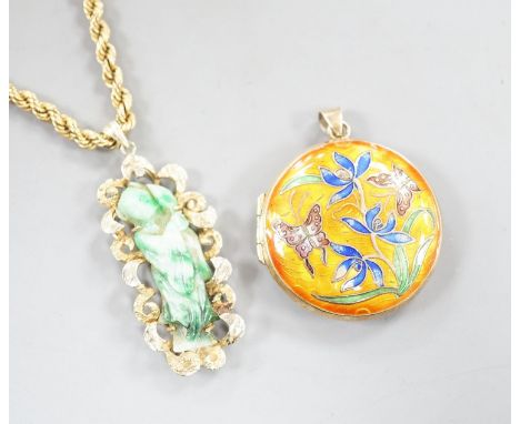 A 14k yellow metal and carved jade set pendant, 45mm, gross 8.5 grams, on a 9ct gold ropetwist chain, 56cm, 10.5 grams and an