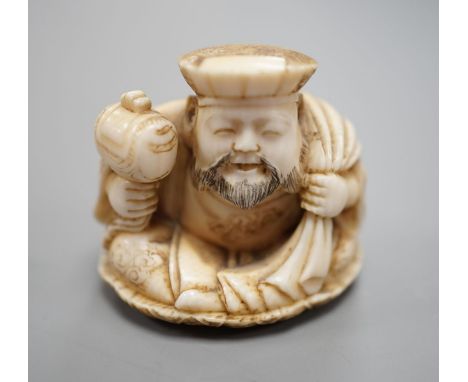 A Japanese ivory netsuke of Daikoku, Meiji period,3 cms high.