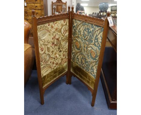 An Arts and Crafts Morris-style embroidered two-fold mahogany framed screen, each panel width 47cm, height 97cm, the embroide