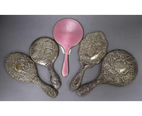 Five assorted silver mounted hand mirrors including pink guilloche enamel and Reynold's Angels.