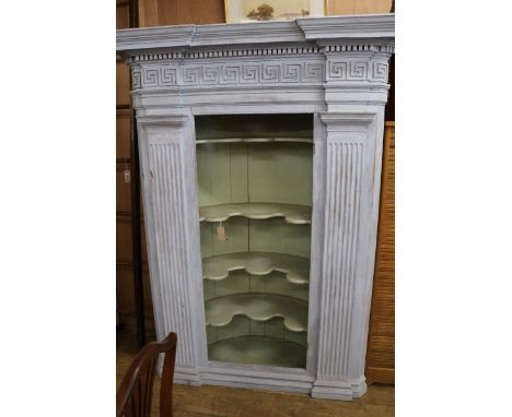An architectural painted corner cupboard W.137cm