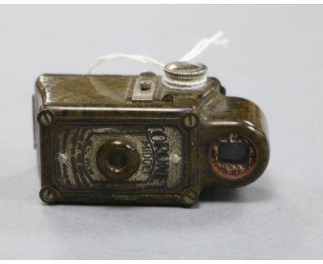 A Coronet Midget green miniature camera