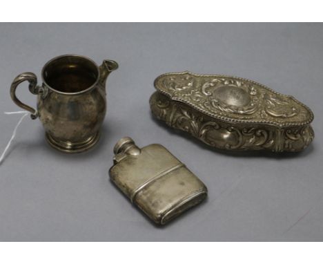 A small George V silver hip flask by Asprey & Co, a Scottish silver cream jug and a repousse silver trinket box.