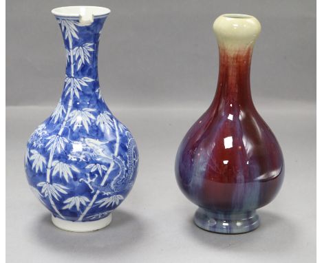 A Chinese blue and white dragon vase and a flambe vase tallest 22.5cm