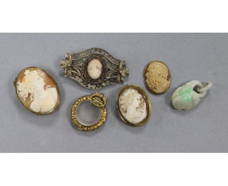 A small group of assorted jewellery including a jade pendant, three cameos, a brooch and a locket.