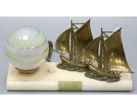 An Art Deco nautical themed lamp, on onyx base